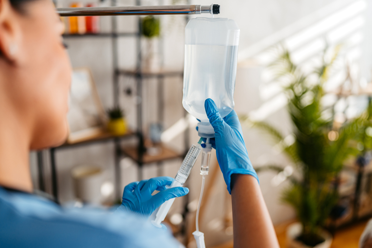 IV therapy drip bag during a mobile IV hydration session at a client's home