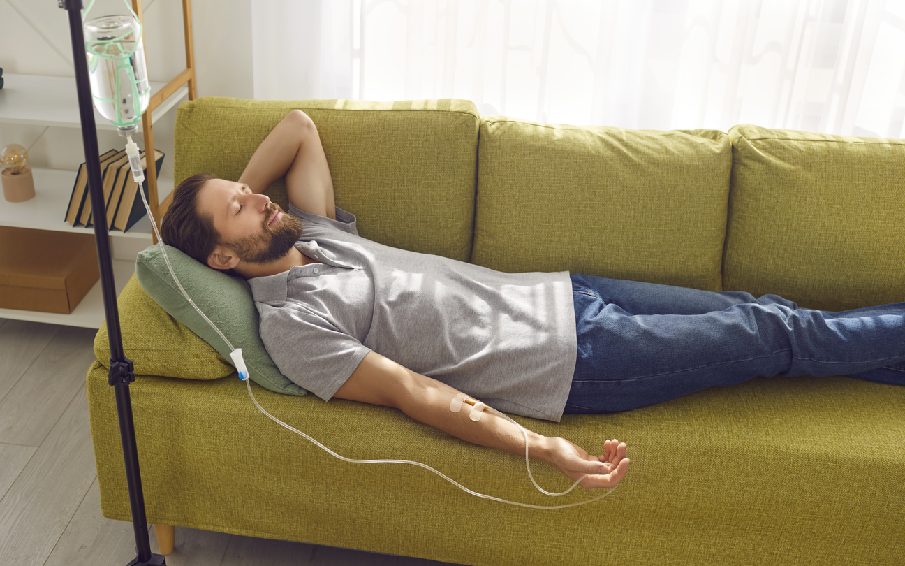 Client relaxing at home in Martin County, Florida while receiving mobile IV hydration therapy from IV Salt Rejuvenation