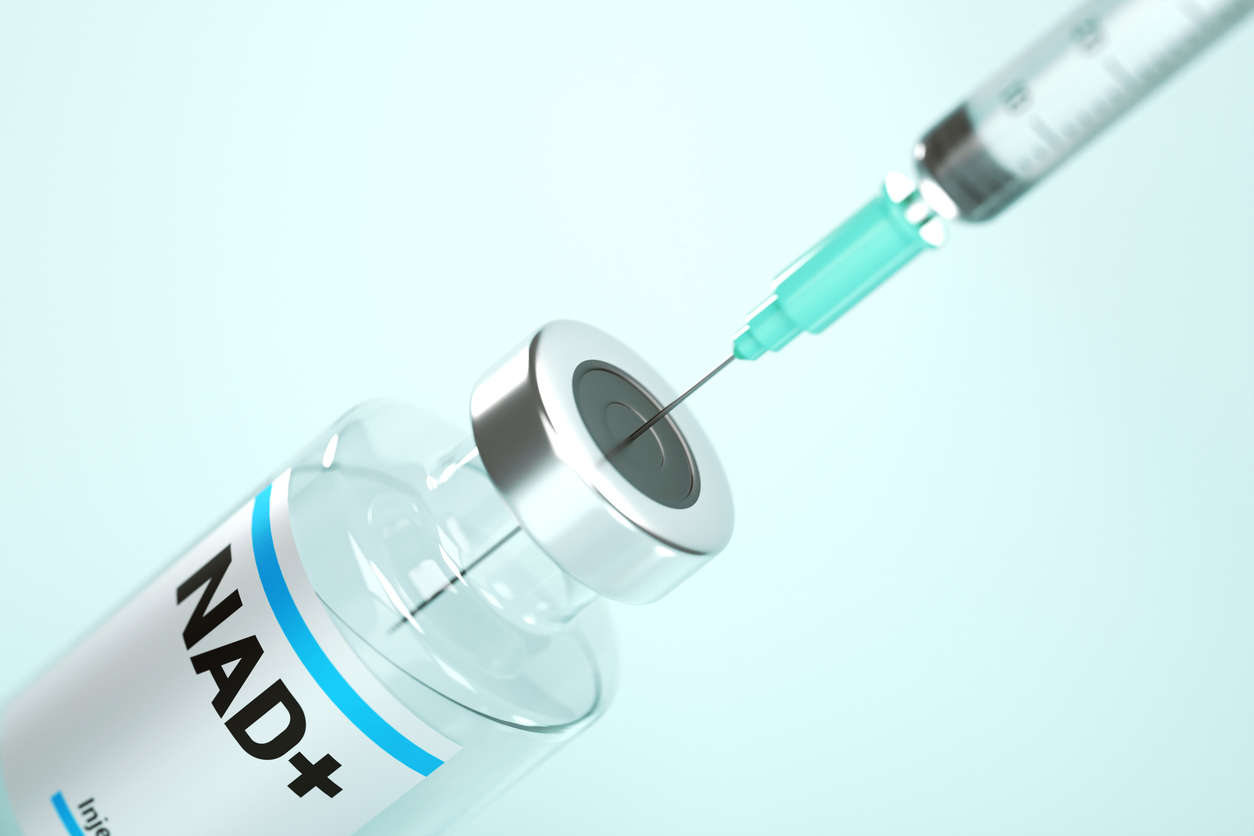 A NAD+ vial and syringe prepared for an intravenous infusion